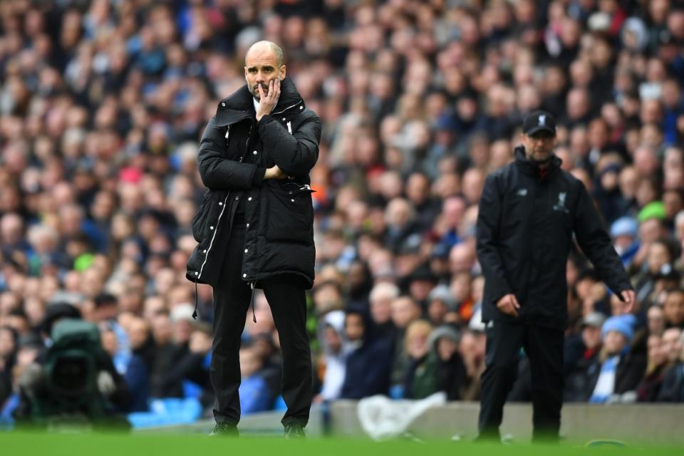 <p>Pep Guardiola looks on, concerned </p>