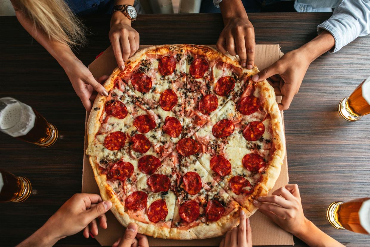 Friends sharing pizza