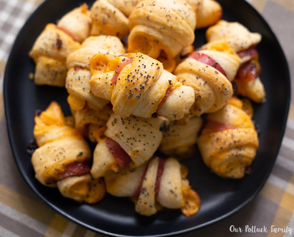 <p>Our Pot Luck Family</p><p>This mini cheddar and ham croissant recipe is easy to prepare and always a crowd pleaser!</p><p><strong>Get the recipe: <a href="https://ourpotluckfamily.com/mini-cheddar-ham-croissant/" rel="nofollow noopener" target="_blank" data-ylk="slk:Mini Cheddar Ham Croissant;elm:context_link;itc:0;sec:content-canvas" class="link rapid-noclick-resp"><em>Mini Cheddar Ham Croissant</em></a></strong></p>