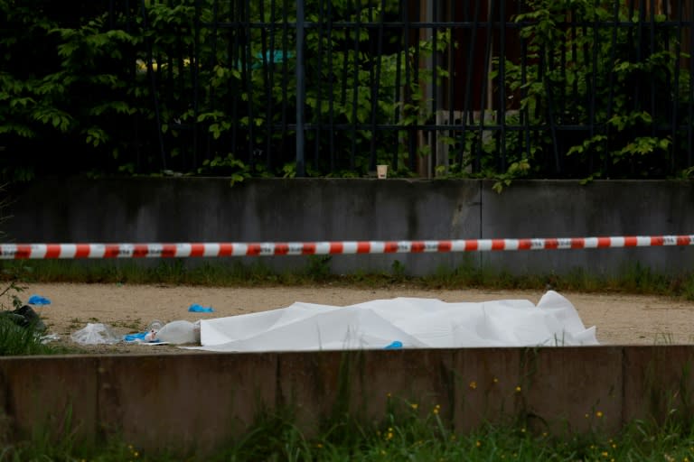 A body covered with a sheet after a double shooting in Sevran, northeast of Paris, on Sunday (Geoffroy VAN DER HASSELT)