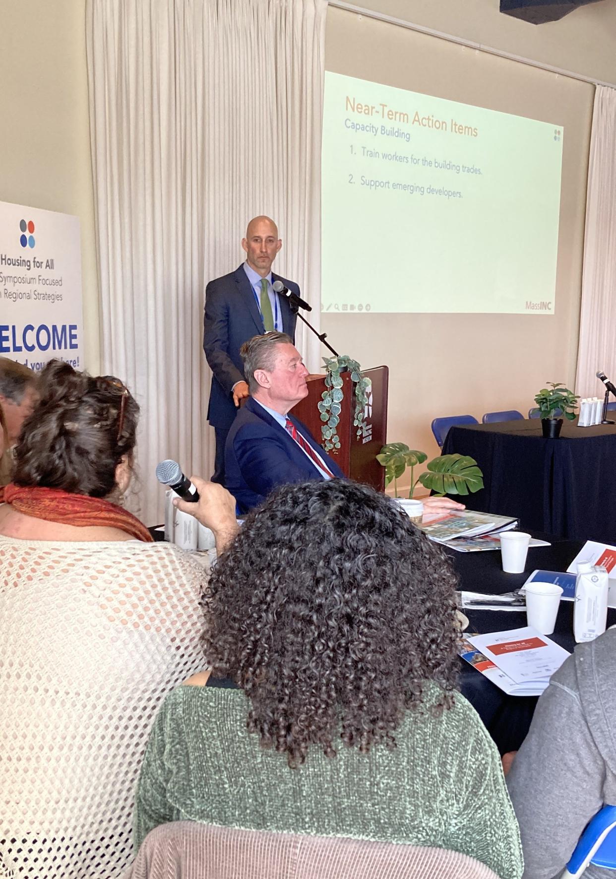 New Bedford Economic Development Council President Anthony Sapienza answers a question about housing as Ed Augustus, Secretary of the Executive Office of Housing and Livable Communities listens in.