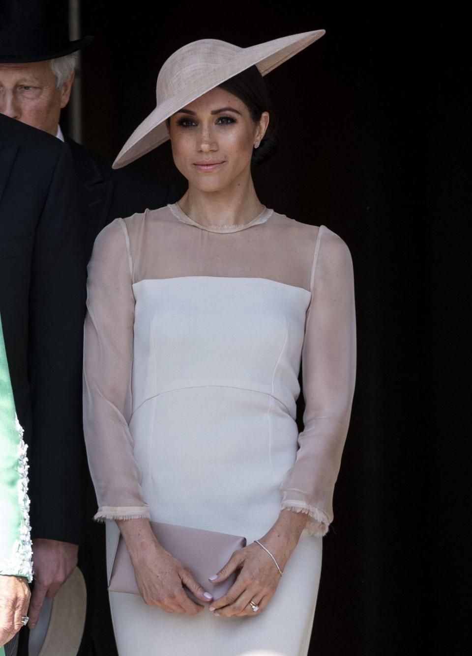 <p>Perhaps Meghan got the idea from Kate to wear pale pink to her <a href="https://www.cosmopolitan.com/entertainment/celebs/a20872110/meghan-markle-prince-harry-first-married-appearance/" rel="nofollow noopener" target="_blank" data-ylk="slk:first official event after her wedding;elm:context_link;itc:0;sec:content-canvas" class="link ">first official event after her wedding</a>. Her dress, paired with a matching fascinator, made her look royal AF, IMO. </p>