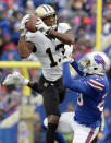 <p>New Orleans Saints’ Michael Thomas (13) catches a pass in front of Buffalo Bills’ Shareece Wright (20) during the second half of an NFL football game Sunday, Nov. 12, 2017, in Orchard Park, N.Y. (AP Photo/Adrian Kraus) </p>