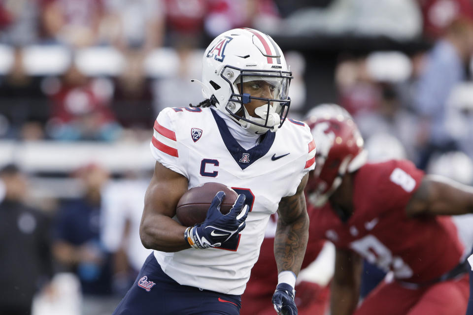 Arizona wide receiver Jacob Cowing carries the ball during the first half of the team's NCAA college football game against Washington State, Saturday, Oct. 14, 2023, in Pullman, Wash. (AP Photo/Young Kwak)