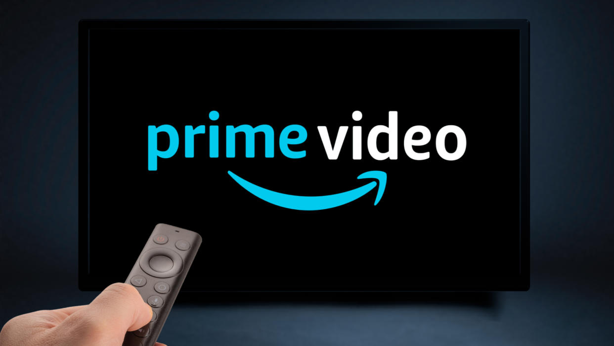  An image of the Prime Video logo on a TV with someone watching it 