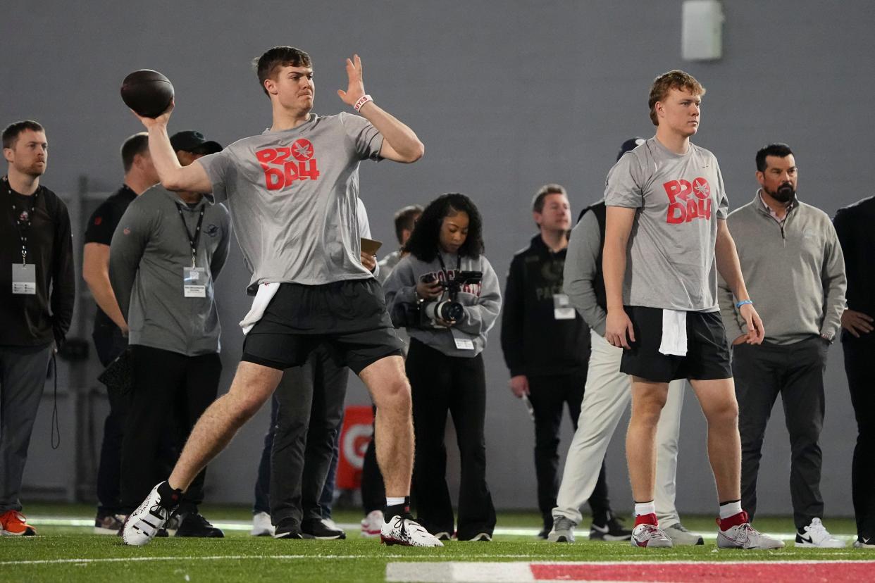 Mar 20, 2024; Columbus, Ohio, USA; Ohio State Buckeyes quarterback Will Howard makes a throw beside quarterback Devin Brown during Pro Day at the Woody Hayes Athletic Center.