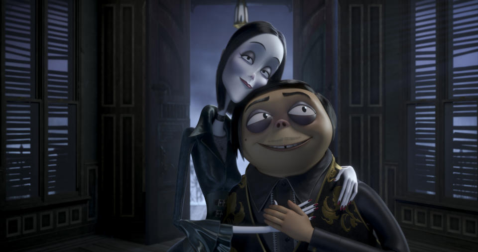 This image released by Metro Goldwyn Mayer Pictures shows characters Morticia Addams, voiced by Charlize Theron, left, and Gomez Addams, voiced by Oscar Isaac, in a scene from "The Addams Family," in theaters on Oct. 11. (Metro Goldwyn Mayer Pictures via AP)