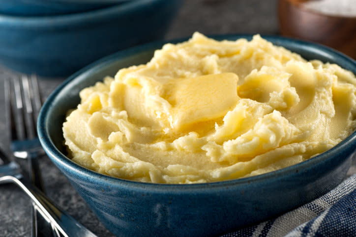 bowl of potatoes with butter on top