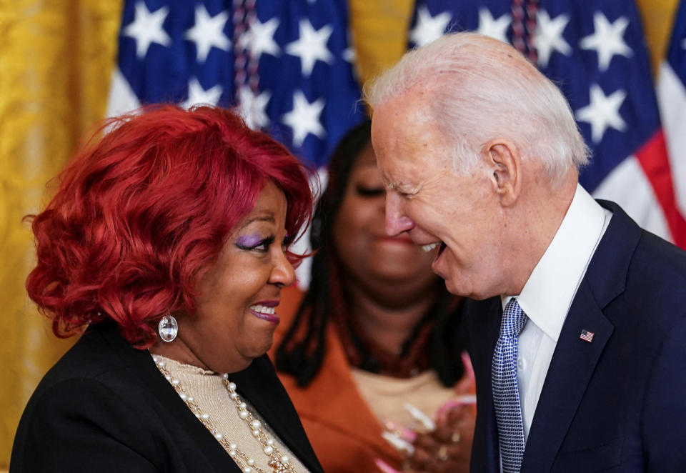 President Biden presents a Presidential Citizens Medal to Georgia election worker Ruby Freeman, as her daughter, fellow election worker and awardee Shaye Moss, watches, in the East Room of the White House. Jan. 6, 2023. 