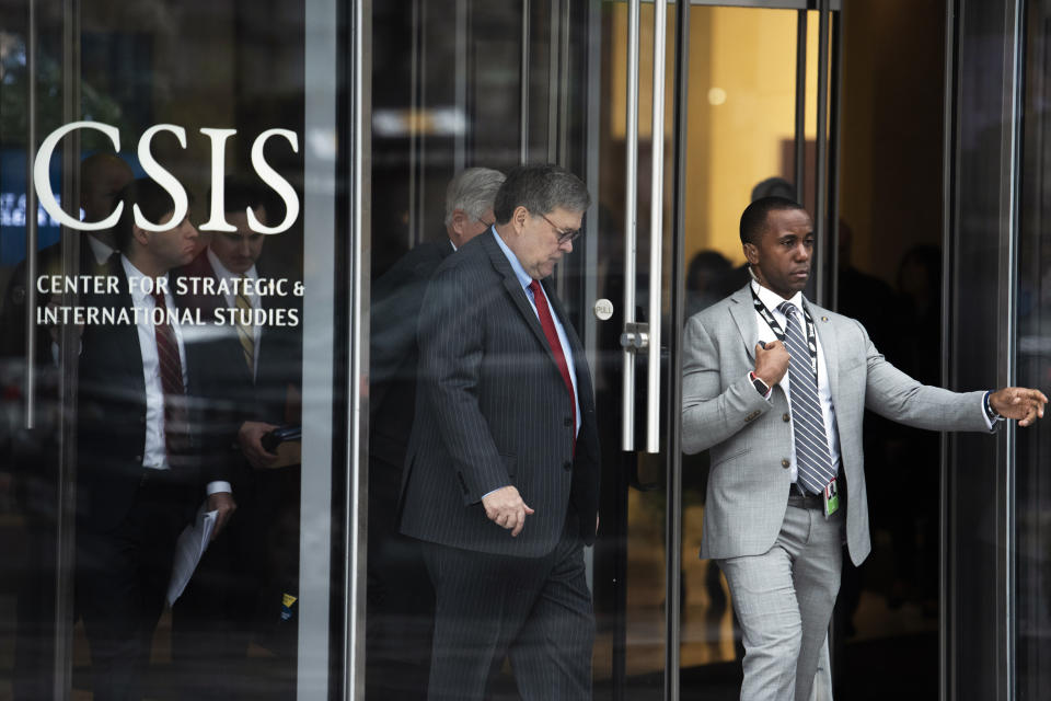 Attorney General William Barr, center, departs the Center for Strategic and International Studies, CSIS China Initiative Conference, Thursday, Feb. 6, 2020, in Washington. (AP Photo/Cliff Owen)