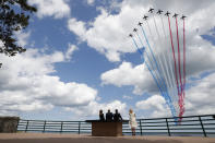 FILE - In this Thursday, June 6, 2019 file photo, President Donald Trump, first lady Melania Trump, French President Emmanuel Macron and Brigitte Macron, watch a flyover during a ceremony to commemorate the 75th anniversary of D-Day at the American Normandy cemetery, in Colleville-sur-Mer, Normandy, France. In sharp contrast to the 75th anniversary of D-Day, this year's 76th will be one of the loneliest remembrances ever, as the coronavirus pandemic is keeping nearly everyone from traveling. (AP Photo/Alex Brandon, File)