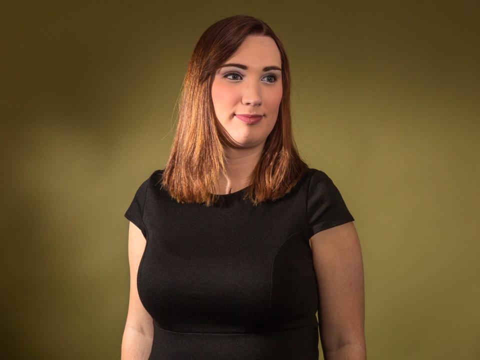 Delaware state senator Sarah McBride poses for a photo, looking away from the camera.