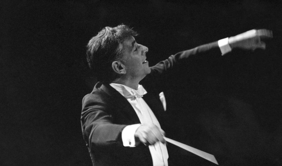 FILE - Leonard Bernstein leads the New York Philharmonic Orchestra in the inaugural concert in New York's new Philharmonic Hall on Sept. 24, 1962. Bernstein is portrayed by actor Bradley Cooper in the upcoming film "Maestro." (AP Photo, File)
