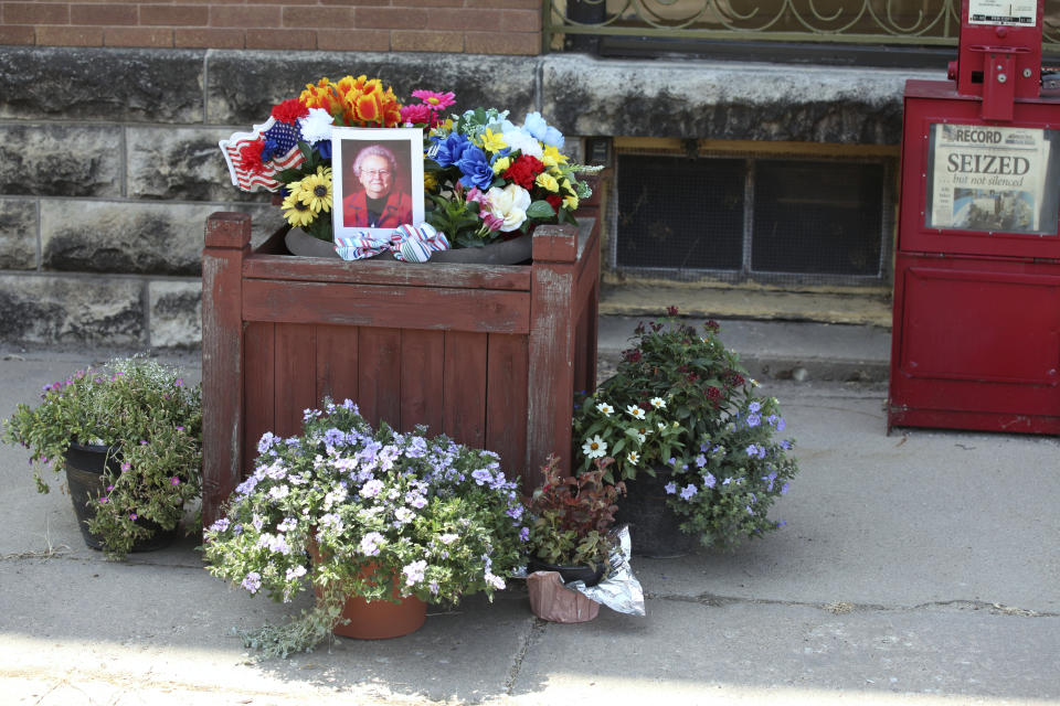 A tribute to Joan Meyer, the late 98-year-old co-owner of the Marion County Record, sits outside the weekly newspaper's office, Monday, Aug. 11, 2023, in Marion, Kansas. Her son, editor and publisher Eric Meyer, blames the stress from police raids on the newspaper offices and their home for her death on Aug. 12, the day after the raids. (AP Photo/John Hanna)