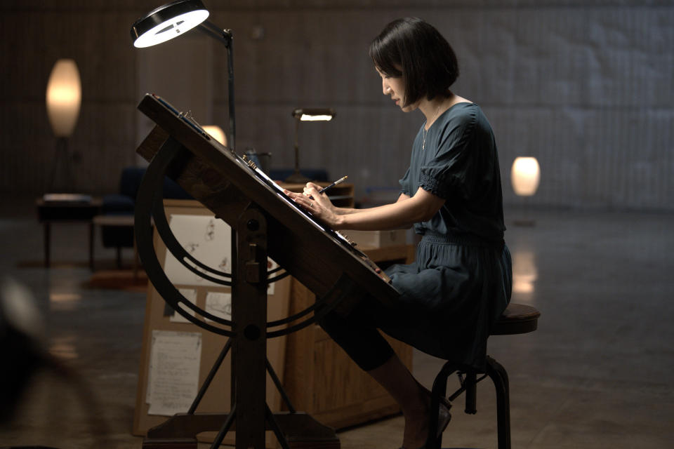 Hyun-Min Lee draws at a desk