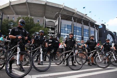 Police stand with their bicycles as a part of a large security presence, outside the football stadium as the NFL's Carolina Panthers host the Minnesota Vikings amid protesting of the police shooting of Keith Scott, in Charlotte, North Carolina, U.S., September 25, 2016. REUTERS/Mike Blake