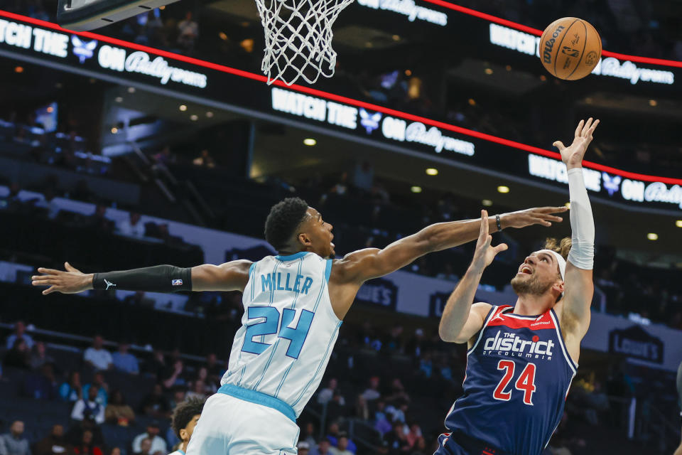 Washington Wizards forward Corey Kispert (24) shoots against Charlotte Hornets forward Brandon Miller (24) during the first half of an NBA basketball game in Charlotte, N.C., Wednesday, Nov. 8, 2023. (AP Photo/Nell Redmond)