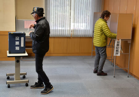 Local residents cast an early vote at a polling station in Erimo Town, on Japan's northern island of Hokkaido, October 12, 2017. Picture taken October 12, 2017. REUTERS/Malcolm Foster