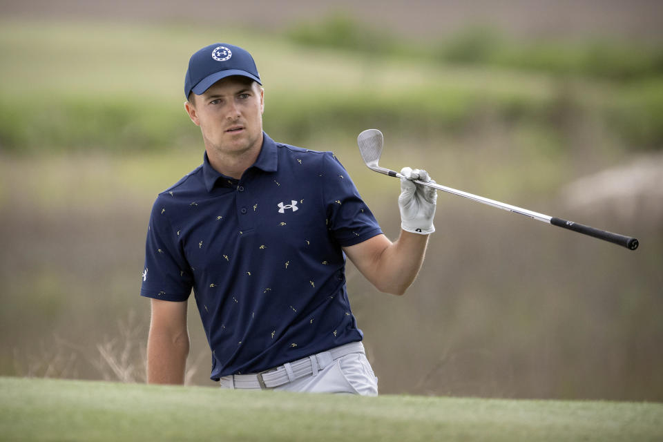Jordan Spieth watches his shot from a bunker on the 18th hole during a one-hole playoff at the RBC Heritage golf tournament, Sunday, April 17, 2022, in Hilton Head Island, S.C. (AP Photo/Stephen B. Morton)