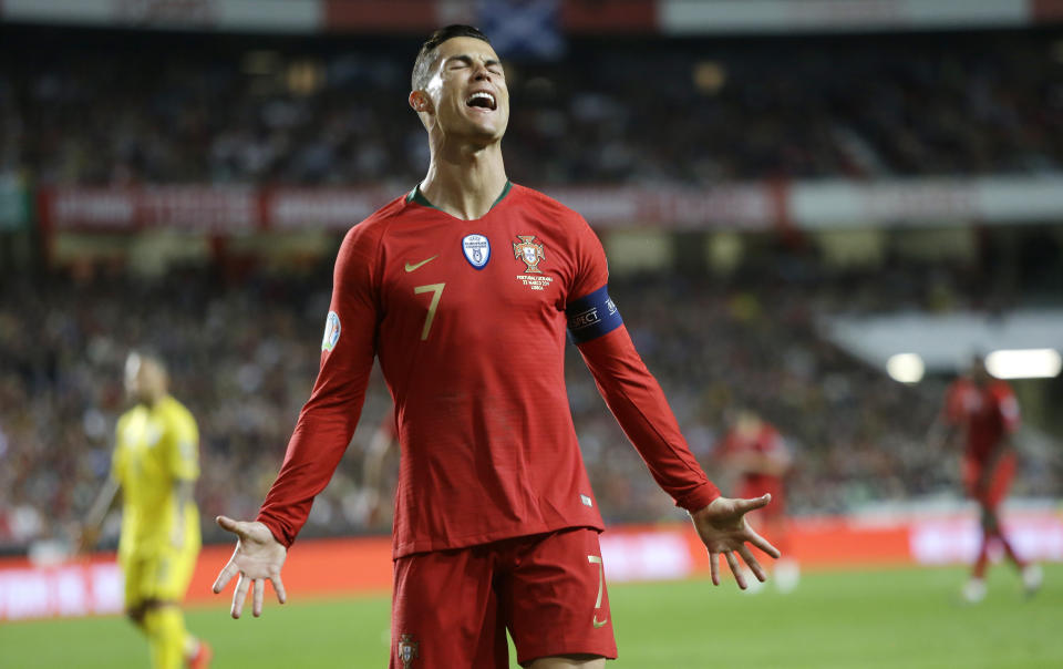 Portugal's Cristiano Ronaldo reacts after missing a scoring chance during the Euro 2020 group B qualifying soccer match between Portugal and Ukraine at the Luz stadium in Lisbon, Friday, March 22, 2019. (AP Photo/Armando Franca)