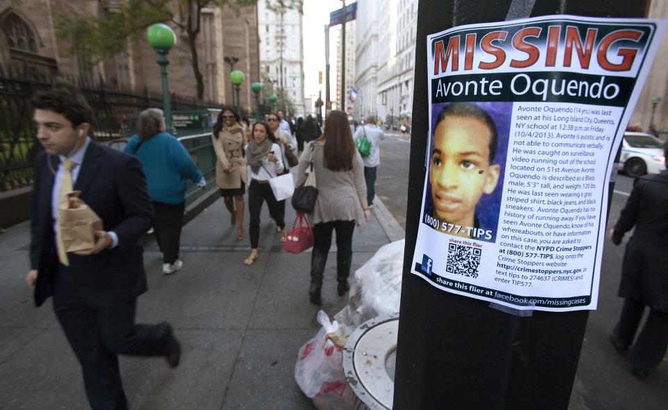 A poster for Avonte Oquendo, a missing 14-year-old autistic child, is seen in downtown New York October 15, 2013. Oquendo has been missing for 11 days since walking out of his school on October 4, and a $70,000 reward has been offered for his safe return. REUTERS/Carlo Allegri (UNITED STATES - Tags: SOCIETY)