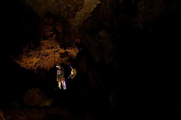 PHOTO: Environmental activist Cristina Nolasco, 32, explores the Yorogana cave, which she says has been affected by the construction of the new Mayan Train route, in Playa del Carmen, Quintana Roo, Mexico, November 6, 2022. (Jose Luis Gonzalez/Reuters)