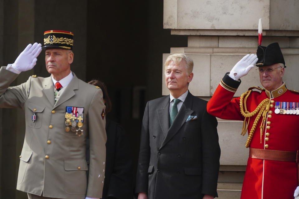 French Chief of the Army Staff, General Pierre Schill, left and Clive Alderton, Private Secretary to Britain's King Charles III and Queen Camilla, centre, watch as Scots Guards and troops from France's 1er Regiment de le Garde Republicaine partake in the Changing of the Guard ceremony at Buckingham Palace, to commemorate the 120th anniversary of the Entente Cordiale - the historic diplomatic agreement between Britain and France which laid the groundwork for their collaboration in both world wars, in London, Monday, April 8, 2024. France is the first non-Commonwealth country to take part in the Changing of the Guard. (Victoria Jones/Pool Photo via AP)