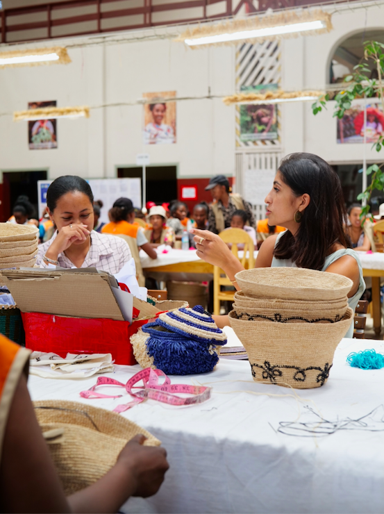 An artisan and Eileen Akbaraly at the Made For A Woman atelier in Madagascar.