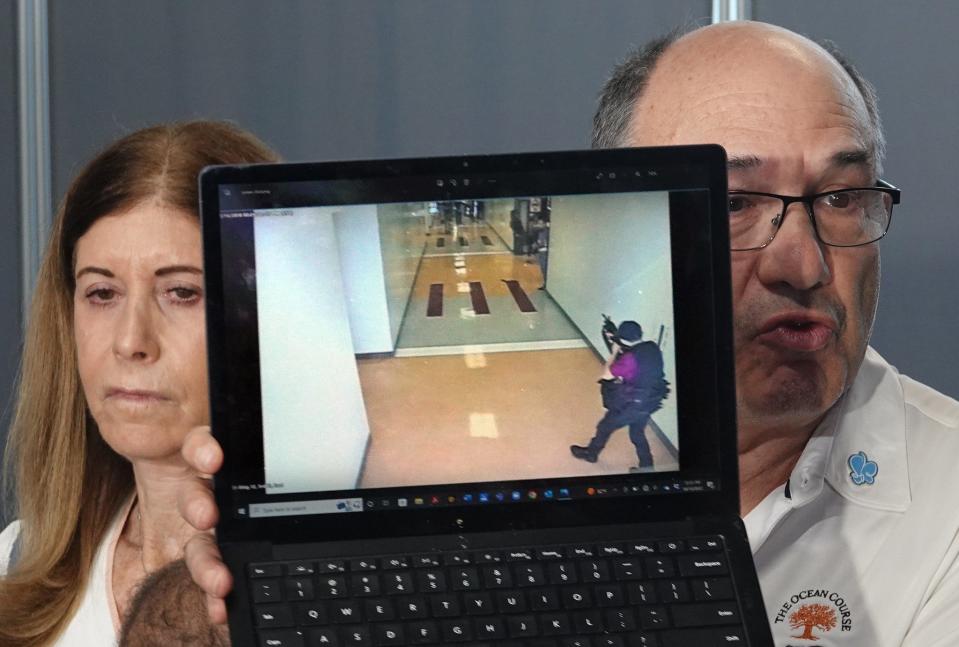 "This was the last thing my son saw," said Michael Schulman as he held a screen shot of the Parkland shooting after the jury recommended life in prison for the Marjory Stoneman Douglas High School shooter in October 2022. The pair's son, cross-country coach Scott Beigel, was killed in the 2018 shootings.