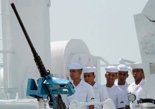 Philippine sailors stand behind a machine gun mounted on the Hamilton-class cutter Gregorio del Pilar during its commissioning ceremony in 2011. The Philippines has hailed the start of major war games with the United States as a timely boost to their military alliance, amid an increasingly tense territorial dispute with China