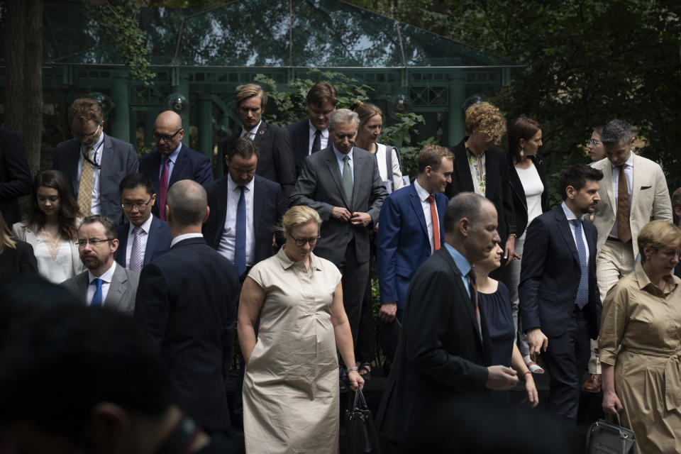 Diplomatic representatives from more than two dozen countries disperse after posing for a group photo at an event held in connection with the announcement of the sentence for Canadian citizen Michael Spavor at the Canadian Embassy in Beijing, Wednesday, Aug. 11, 2021. A Chinese court has sentenced Spavor to 11 years on spying charges in case linked to Huawei. (AP Photo/Mark Schiefelbein)