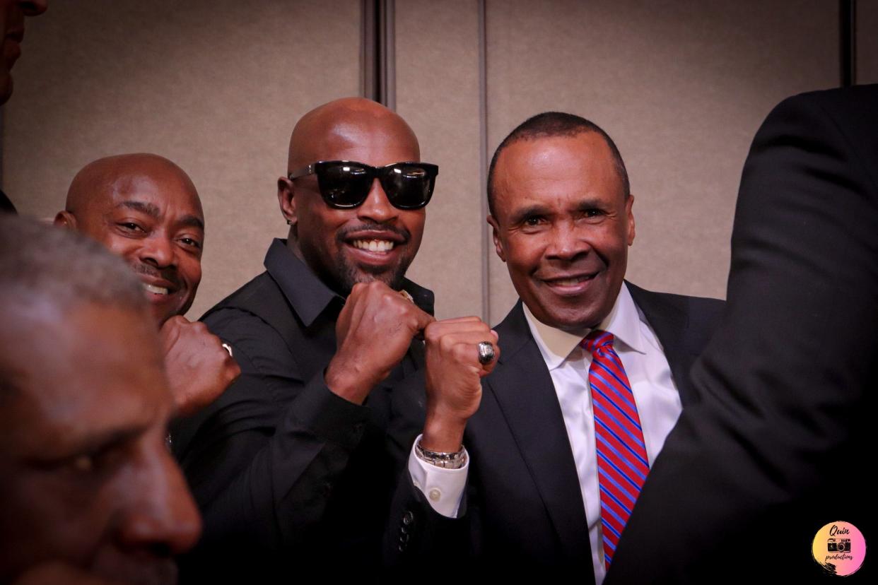 Wearing sunglasses, James Hagler Jr., the grandson of legendary boxer Marvelous Marvin Hagler of Brockton, strikes a pose with 1997 inductee "Sugar" Ray Leonard, right, at the International Boxing Hall of Fame in Canastota, New York. Hagler Jr. will make his Massachusetts ring debut on May 14 in Dedham.