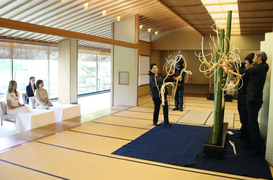 First lady Melania Trump, left, and Akie Abe, wife of Japanese Prime Minister Shinzo Abe watch the Japanese art of the traditional flower arrangement called Ikebana, at Akasaka Palace in Tokyo, Monday, May 27, 2019. (AP Photo/Koji Sasahara)