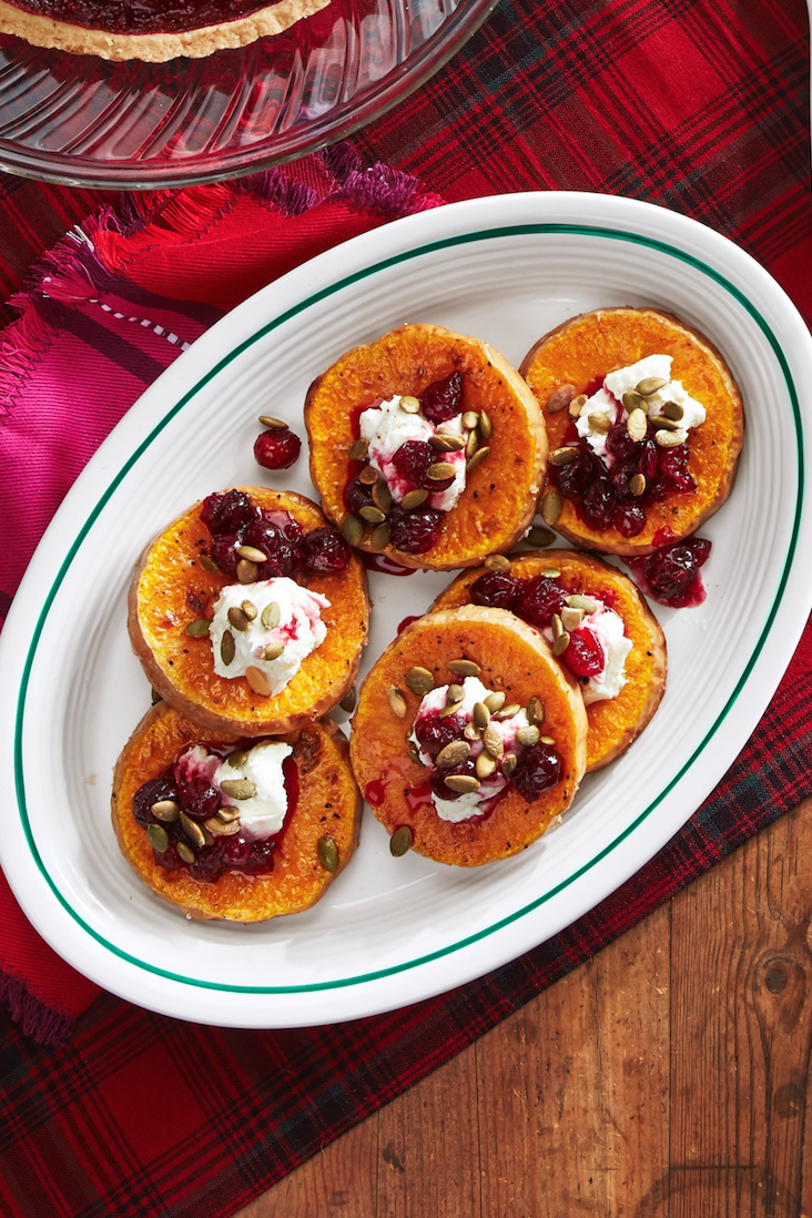 <p>Cranberries simmered in orange juice and maple syrup sweetens up this colorful goat cheese-topped butternut squash.</p><p><strong><a href="https://www.countryliving.com/food-drinks/a29628010/roasted-squash-with-goat-cheese-and-poached-cranberries-recipe/" rel="nofollow noopener" target="_blank" data-ylk="slk:Get the recipe for Roasted Squash with Goat Cheese and Poached Cranberries;elm:context_link;itc:0;sec:content-canvas" class="link ">Get the recipe for Roasted Squash with Goat Cheese and Poached Cranberries</a>.</strong> </p>