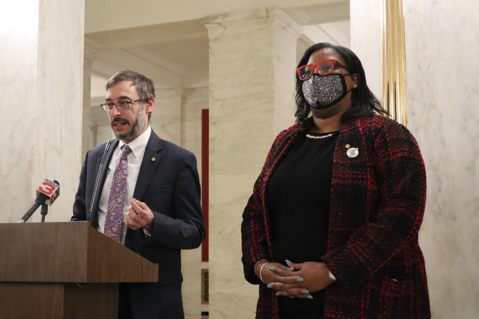 West Virginia Democratic Dels. Evan Hansen and Danielle Walker of Monongalia County speak at a news conference at the West Virginia state Capitol in Charleston, W.Va. on Jan. 31, 2022 about a bill they are proposing that would lift restrictions on abortion in the state. Republican lawmakers in West Virginia have already introduced a different bill this session that would ban abortion after 15 weeks — a proposal nearly identical to the Mississippi law currently under review by the U.S. Supreme Court. (AP Photo/Leah Willingham)