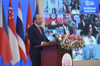 Vietnamese Prime Minister Nguyen Xuan Phuc delivers a speech at the opening ceremony of the 36th ASEAN Summit in Hanoi, Vietnam Friday, June 26, 2020. Leaders from the Southeast Asian ten-nation bloc hold the bi-annual summit via online video conference to discuss regional issues. (AP Photo/Hau Dinh)