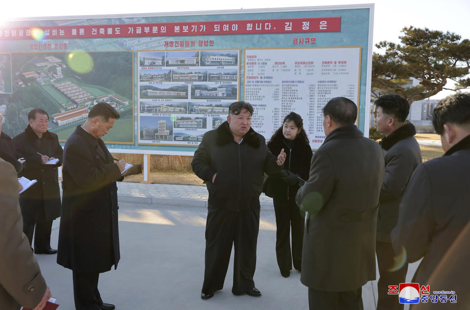In this photo provided on Monday, Jan. 8, 2024, by the North Korean government, North Korean leader Kim Jong Un, center, with his daughter visits a newly-built poultry factory in Hwangju County of North Hwanghae Province on Jan. 7, 2024. Independent journalists were not given access to cover the event depicted in this image distributed by the North Korean government. The content of this image is as provided and cannot be independently verified. Korean language watermark on image as provided by source reads: "KCNA" which is the abbreviation for Korean Central News Agency. (Korean Central News Agency/Korea News Service via AP)