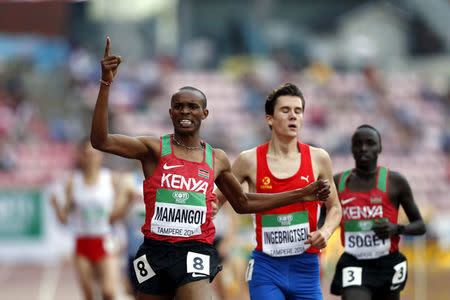 FILE PHOTO: Athletics - 2018 IAAF World U20 Championships – men's 1500m – Tampere, Finland – July 12, 2018. George Meitamei Manangoi of Kenya crosses the finish line ahead of Jakob Ingebrigtsen of Norway. Lehtikuva/Kalle Parkkinen via REUTERS ATT