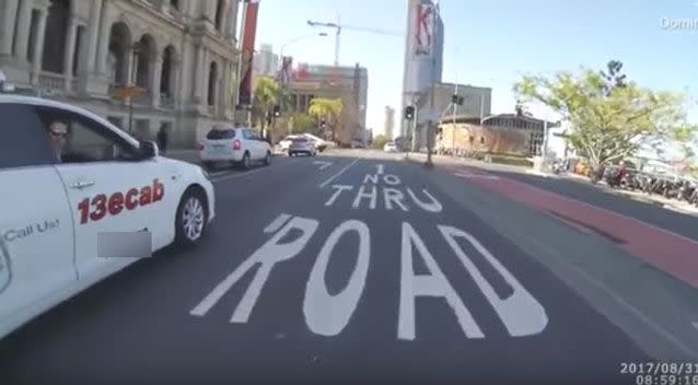 The cyclist stops in the middle of the road and tells the furious driver to 