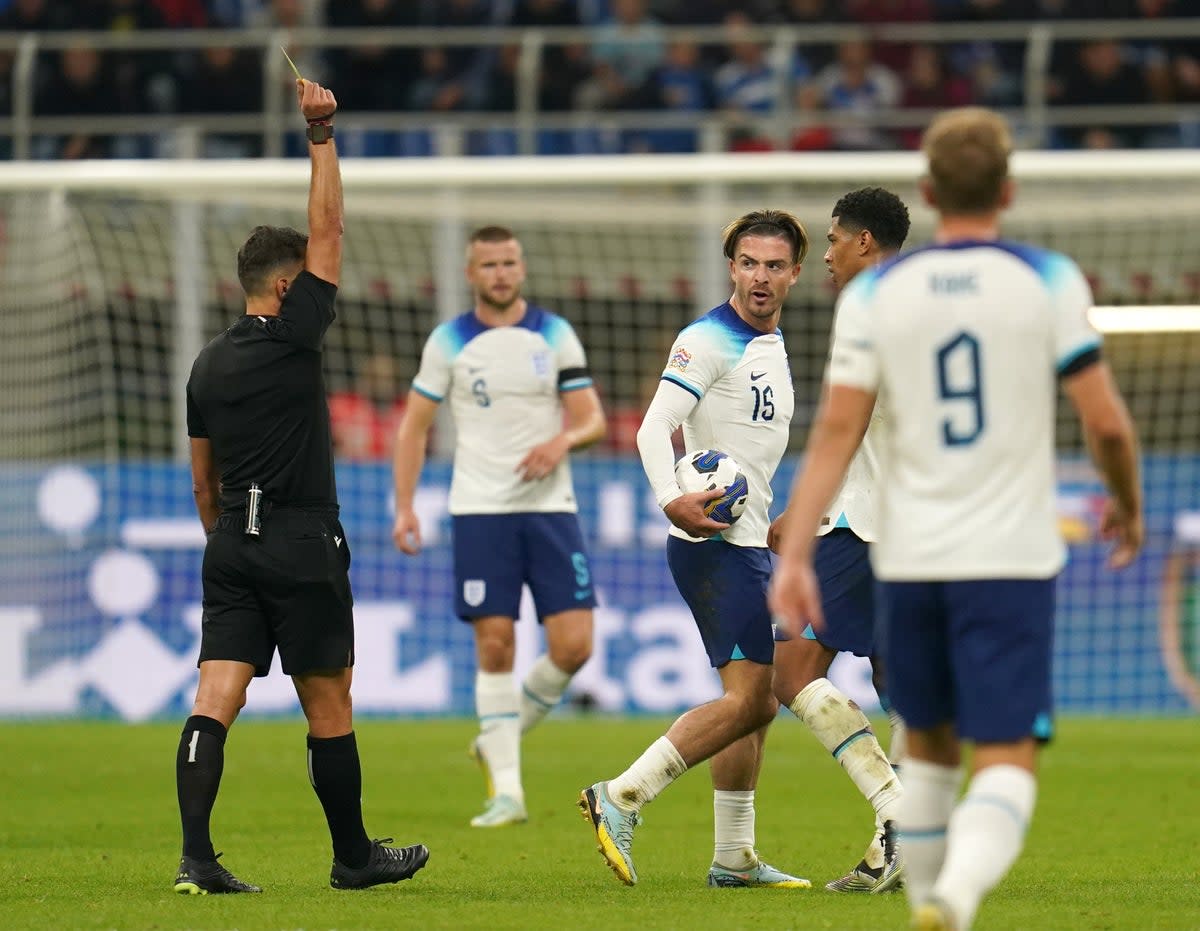 England’s Jack Grealish receives a yellow card from referee Jesus Gil Manzano (Nick Potts/PA) (PA Wire)