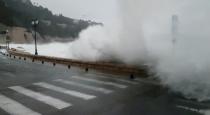 Waves crash on the street in Villefranche-Sur-Mer