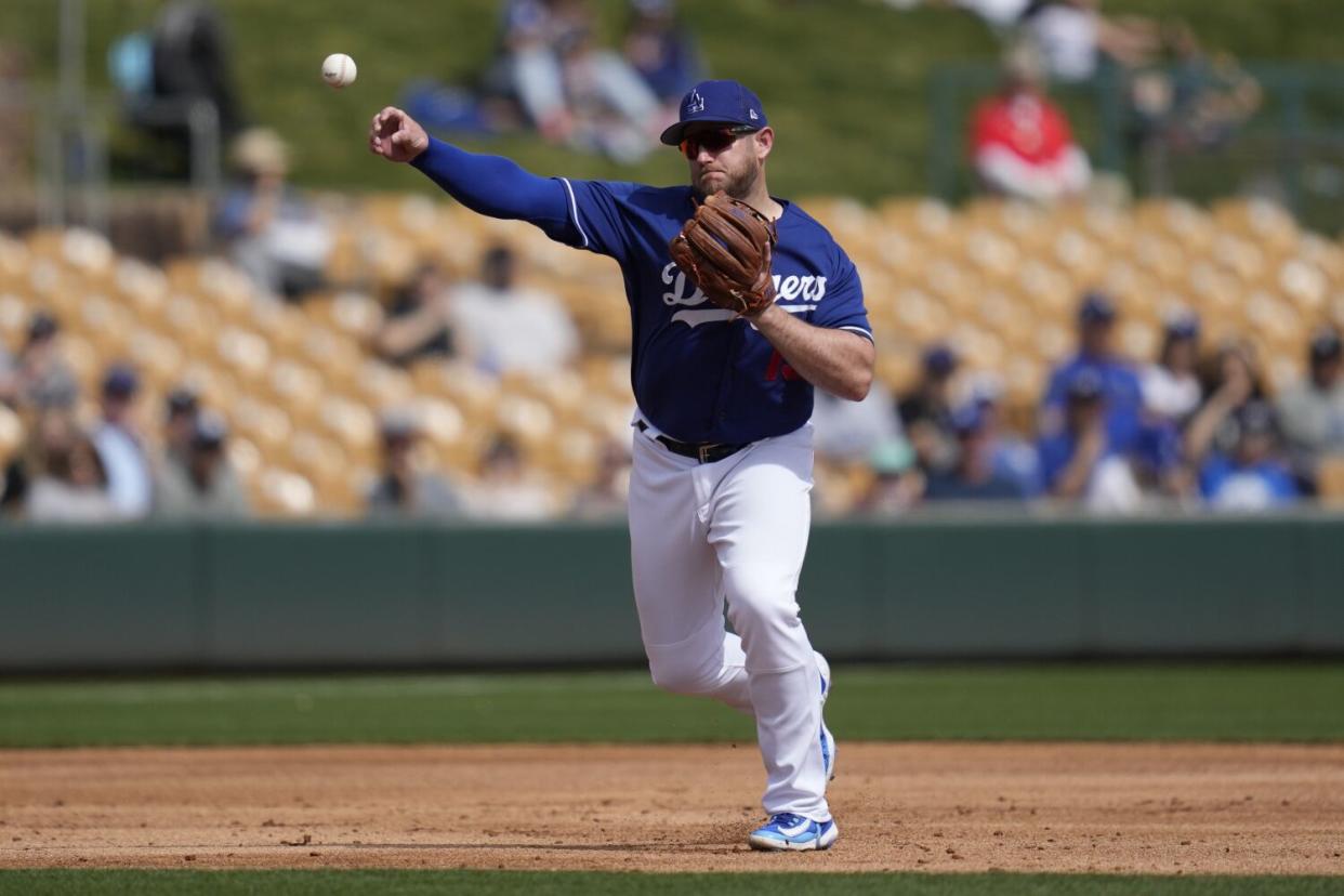 Dodgers third baseman Max Muncy throws to first during a spring game against the San Diego Padres.