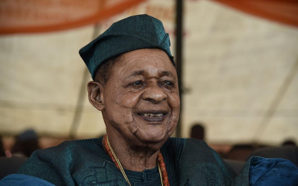 The Alaafin of Oyo looks on at the Igbo-Ora World Twins Festival, which celebrates the predominance of twin births in the area - Utomi Ekpei/AFP via Getty Images