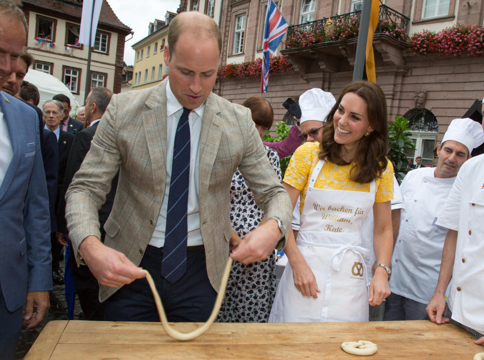 HEIDELBERG, GERMANY - JULY 20:  (NO UK SALES FOR 28 DAYS FROM CREATE DATE) Prince William, Duke of Cambridge and Catherine, Duchess of Cambridge make pretzels as they tour a traditional German market in the Central Square during an official visit to Poland and Germany on July 20, 2017 in Heidelberg, Germany.  (Photo by Pool/Samir Hussein/WireImage)