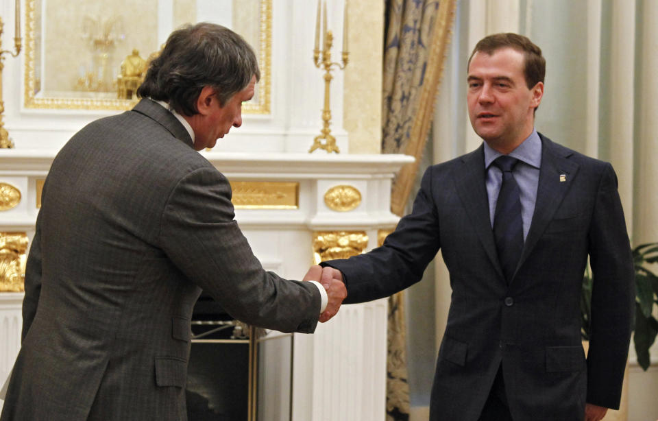 Russian Prime Minister Dmitry Medvedev, right, shakes hands with Igor Sechin, appointed as CEO of state-controlled Russian oil company Rosneft, during their meeting in Moscow, Tuesday, May 22, 2012. (AP Photo/RIA-Novosti, Dmitry Astakhov, Presidential Press Service)