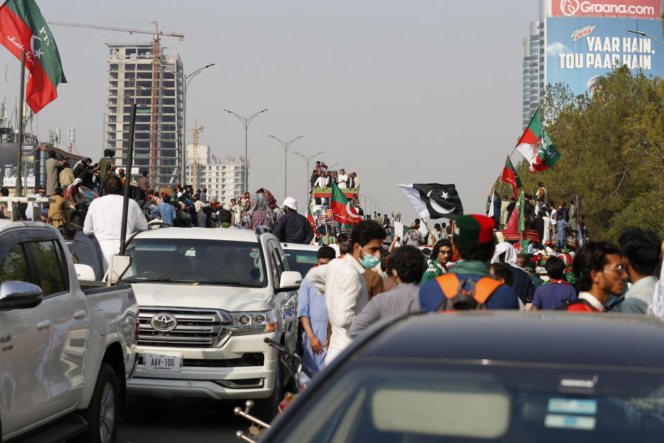 Supporters of Pakistan’s defiant former Prime Minister Imran Khan take part in an anti-government rally in Islamabad, Pakistan, Thursday, May 26, 2022. Khan early Thursday warned Pakistan's government to set new elections in the next six days or he will again march on the capital along with 3 million people. (AP Photo/Anjum Naveed)