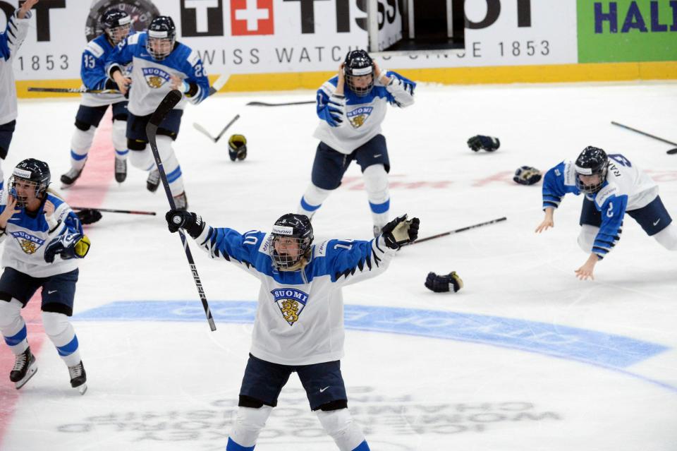 Finnish players celebrate a game-winning overtime goal which was later disallowed during the IIHF Women's Ice Hockey World Championships final match between the United States and Finland in Espoo, Finland, on Sunday, April 14, 2019. (Mikko Stig/Lehtikuva via AP)