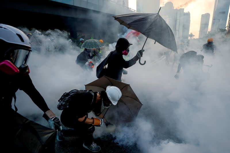 Pictures of the Year: Hong Kong protest tide turns into sea of flames