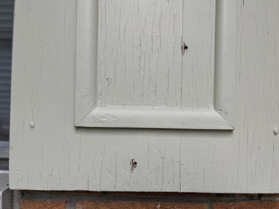 Bullet holes remain in the family home of the Huffman family in Community Heights.