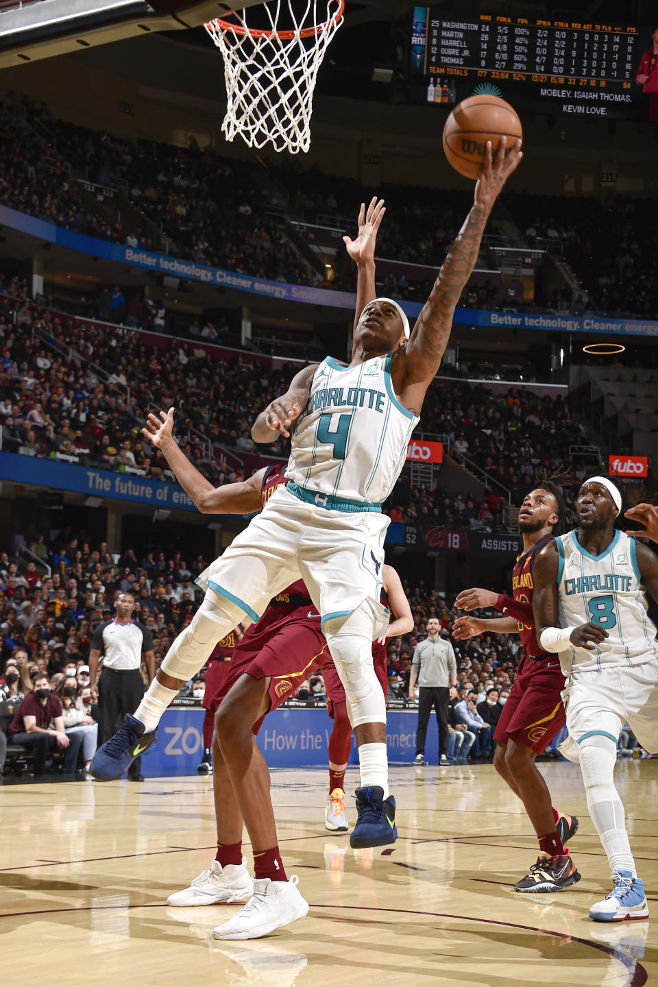 Isaiah Thomas leaps in the air while releasing a basketball from his hand.